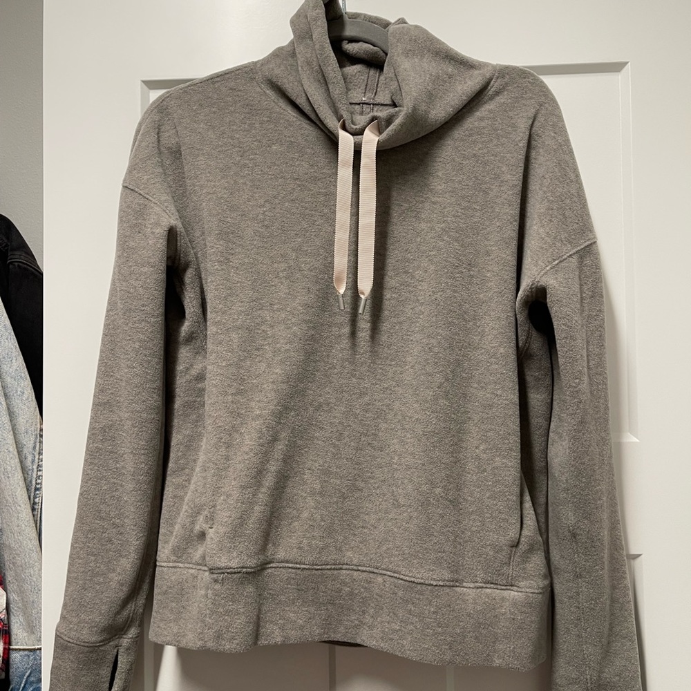 Lululemon gently used fleece turtleneck, light grey with pink accents.